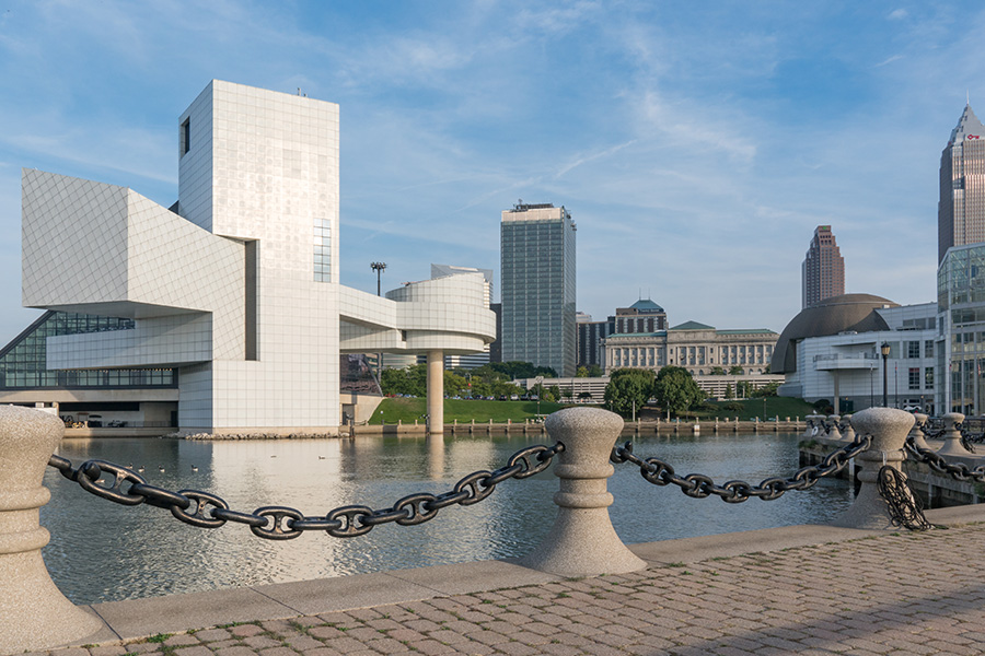 Contact - View of Cleveland Ohio Skyline from Harbor Walkway Displaying Modern Buildings and a River